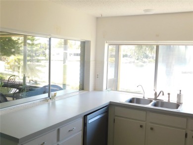 Experience peaceful pond-side living with stunning sunset views on Beacon Woods Golf Club in Florida - for sale on GolfHomes.com, golf home, golf lot