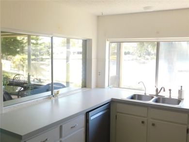 Experience peaceful pond-side living with stunning sunset views on Beacon Woods Golf Club in Florida - for sale on GolfHomes.com, golf home, golf lot
