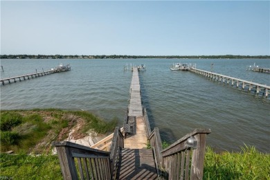 Perfectly Positioned on the pinnacle of a beautiful bluff on The Tradition Golf Club At Broad Bay in Virginia - for sale on GolfHomes.com, golf home, golf lot