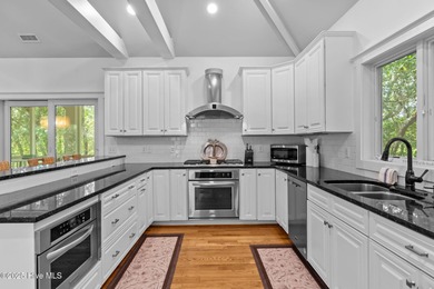 Tucked within the maritime forest and overlooking the 15th on Bald Head Island Golf Club in North Carolina - for sale on GolfHomes.com, golf home, golf lot