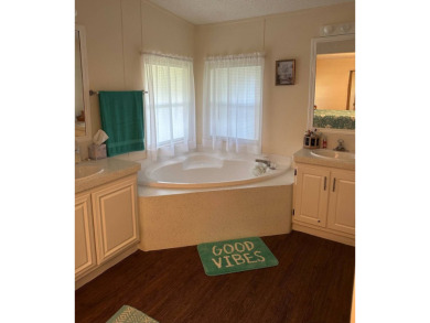 Manufactured Home on Leased Land with Lot Rent. This inviting on Whisperwood Golf Course in Florida - for sale on GolfHomes.com, golf home, golf lot