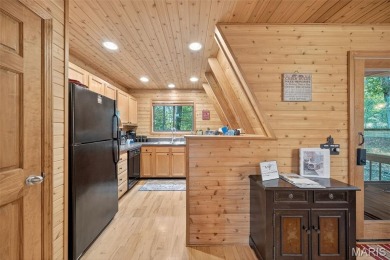 Welcome to 1746 Sonnenblick Drive -- a stunning chalet retreat on Innsbrook Resort Golf Course in Missouri - for sale on GolfHomes.com, golf home, golf lot