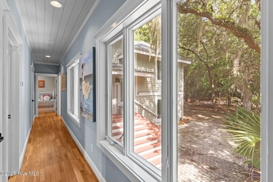 Tucked within the maritime forest and overlooking the 15th on Bald Head Island Golf Club in North Carolina - for sale on GolfHomes.com, golf home, golf lot