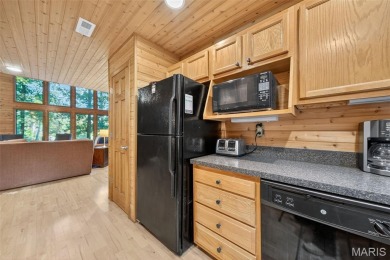 Welcome to 1746 Sonnenblick Drive -- a stunning chalet retreat on Innsbrook Resort Golf Course in Missouri - for sale on GolfHomes.com, golf home, golf lot