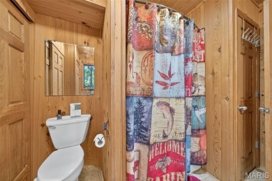 Welcome to 1746 Sonnenblick Drive -- a stunning chalet retreat on Innsbrook Resort Golf Course in Missouri - for sale on GolfHomes.com, golf home, golf lot