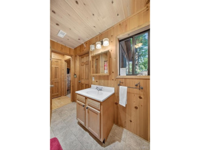 Welcome to 1746 Sonnenblick Drive -- a stunning chalet retreat on Innsbrook Resort Golf Course in Missouri - for sale on GolfHomes.com, golf home, golf lot