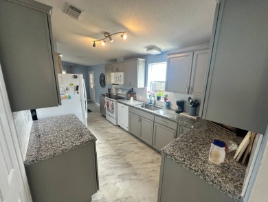 Beautiful stucco home on a quiet cul de sac. Tastefully updated on Del Tura Golf and Country Club in Florida - for sale on GolfHomes.com, golf home, golf lot