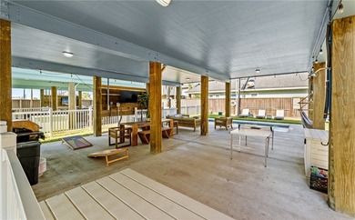 Welcome to this stunning 2021 built stilt style coastal retreat on Palmilla Beach Golf Club in Texas - for sale on GolfHomes.com, golf home, golf lot