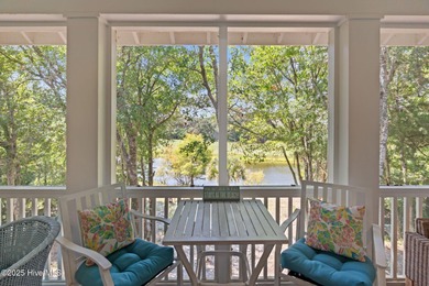 Tucked within the maritime forest and overlooking the 15th on Bald Head Island Golf Club in North Carolina - for sale on GolfHomes.com, golf home, golf lot