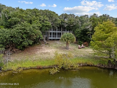 Tucked within the maritime forest and overlooking the 15th on Bald Head Island Golf Club in North Carolina - for sale on GolfHomes.com, golf home, golf lot