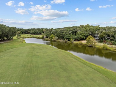 Tucked within the maritime forest and overlooking the 15th on Bald Head Island Golf Club in North Carolina - for sale on GolfHomes.com, golf home, golf lot