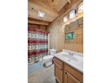 Welcome to 1746 Sonnenblick Drive -- a stunning chalet retreat on Innsbrook Resort Golf Course in Missouri - for sale on GolfHomes.com, golf home, golf lot