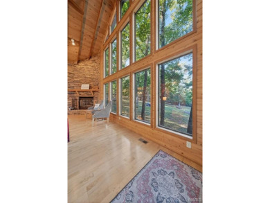 Welcome to 1746 Sonnenblick Drive -- a stunning chalet retreat on Innsbrook Resort Golf Course in Missouri - for sale on GolfHomes.com, golf home, golf lot