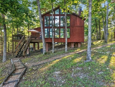 Welcome to 1746 Sonnenblick Drive -- a stunning chalet retreat on Innsbrook Resort Golf Course in Missouri - for sale on GolfHomes.com, golf home, golf lot