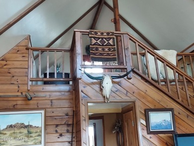 This beautiful Mountain Cabin in White Mountain Lakes has much on Silver Creek Golf Club in Arizona - for sale on GolfHomes.com, golf home, golf lot