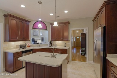 Nestled in a prestigious gated golf community, this brick home on Brunswick Plantation and Golf Resorts in North Carolina - for sale on GolfHomes.com, golf home, golf lot
