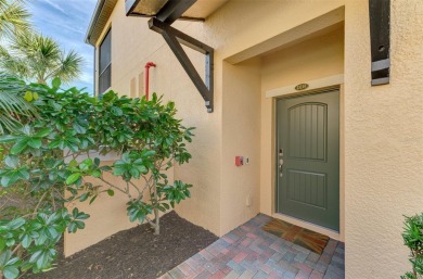 This stunning, rarely available, first level end-unit Bella Casa on Sarasota National Golf Club in Florida - for sale on GolfHomes.com, golf home, golf lot