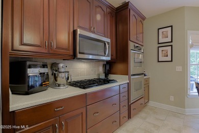 Nestled in a prestigious gated golf community, this brick home on Brunswick Plantation and Golf Resorts in North Carolina - for sale on GolfHomes.com, golf home, golf lot