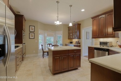 Nestled in a prestigious gated golf community, this brick home on Brunswick Plantation and Golf Resorts in North Carolina - for sale on GolfHomes.com, golf home, golf lot