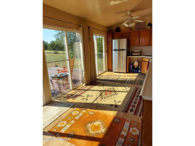 This beautiful Mountain Cabin in White Mountain Lakes has much on Silver Creek Golf Club in Arizona - for sale on GolfHomes.com, golf home, golf lot