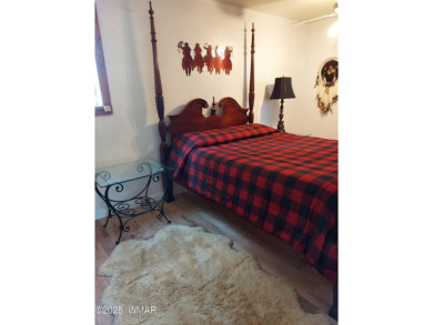 This beautiful Mountain Cabin in White Mountain Lakes has much on Silver Creek Golf Club in Arizona - for sale on GolfHomes.com, golf home, golf lot