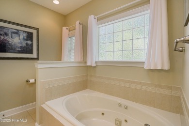 Nestled in a prestigious gated golf community, this brick home on Brunswick Plantation and Golf Resorts in North Carolina - for sale on GolfHomes.com, golf home, golf lot