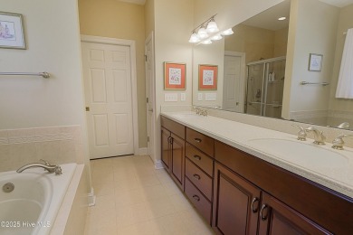 Nestled in a prestigious gated golf community, this brick home on Brunswick Plantation and Golf Resorts in North Carolina - for sale on GolfHomes.com, golf home, golf lot