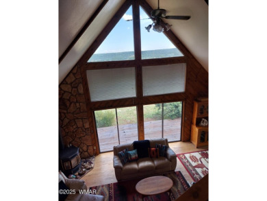 This beautiful Mountain Cabin in White Mountain Lakes has much on Silver Creek Golf Club in Arizona - for sale on GolfHomes.com, golf home, golf lot