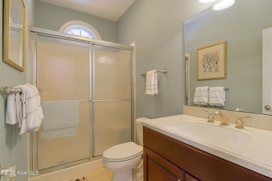 Nestled in a prestigious gated golf community, this brick home on Brunswick Plantation and Golf Resorts in North Carolina - for sale on GolfHomes.com, golf home, golf lot