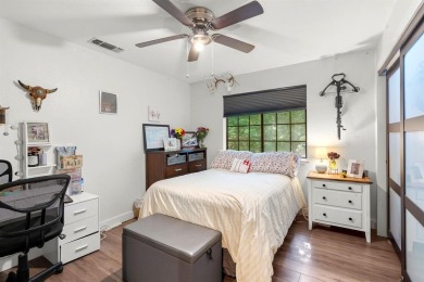 Secluded 3 bedroom 2 bath home surrounded on all 4 sides by on Holly Lake Ranch Golf Club in Texas - for sale on GolfHomes.com, golf home, golf lot