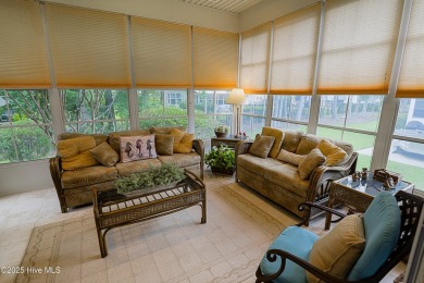 Nestled in a prestigious gated golf community, this brick home on Brunswick Plantation and Golf Resorts in North Carolina - for sale on GolfHomes.com, golf home, golf lot
