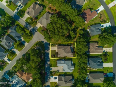Nestled in a prestigious gated golf community, this brick home on Brunswick Plantation and Golf Resorts in North Carolina - for sale on GolfHomes.com, golf home, golf lot