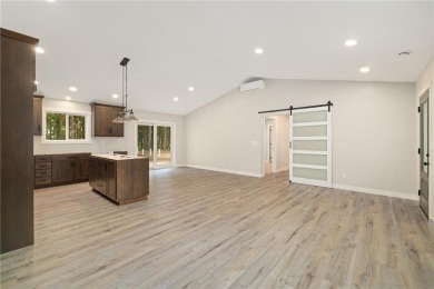 Discover this beautifully crafted home ideally situated with on Headwaters Country Club in Minnesota - for sale on GolfHomes.com, golf home, golf lot