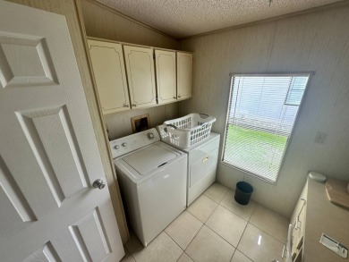 This well loved 2 bedroom, 2 bathroom Palm Harbor home is being on Del Tura Golf and Country Club in Florida - for sale on GolfHomes.com, golf home, golf lot
