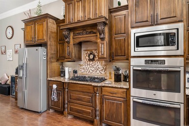 Stunning Lake Maria home featuring a private boat dock and on Isabella Golf Course  in Arkansas - for sale on GolfHomes.com, golf home, golf lot