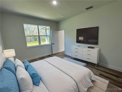 Discover this stunning, brand-new home in Citrus Springs on Citrus Springs Country Club in Florida - for sale on GolfHomes.com, golf home, golf lot