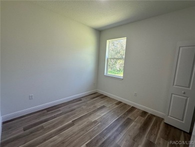 Discover this stunning, brand-new home in Citrus Springs on Citrus Springs Country Club in Florida - for sale on GolfHomes.com, golf home, golf lot