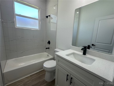 Discover this stunning, brand-new home in Citrus Springs on Citrus Springs Country Club in Florida - for sale on GolfHomes.com, golf home, golf lot