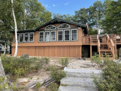 This cozy cottage sits close to the water's edge with 145' of on Frye Island Golf Club in Maine - for sale on GolfHomes.com, golf home, golf lot