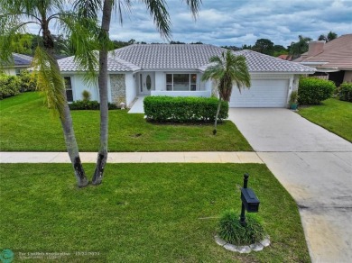 This home boasts the most magnificent view in Boca Greens! The on Boca Greens Country Club in Florida - for sale on GolfHomes.com, golf home, golf lot