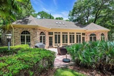 Discover classic lowcountry living in this elegant all-brick on Heritage Club in South Carolina - for sale on GolfHomes.com, golf home, golf lot
