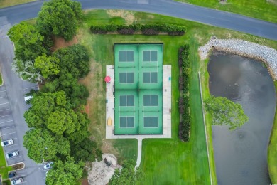Discover classic lowcountry living in this elegant all-brick on Heritage Club in South Carolina - for sale on GolfHomes.com, golf home, golf lot