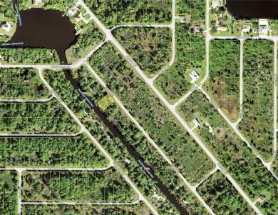 This waterfront lot is located in Port Charlotte is on Florida's on Riverwood Golf Club in Florida - for sale on GolfHomes.com, golf home, golf lot