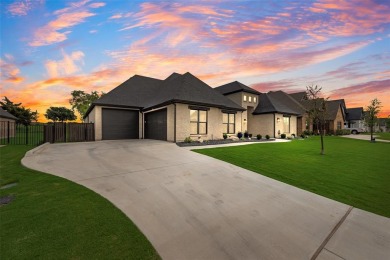 Welcome to this stunning custom-built single-story home on The Golf Club at Resort Eagle Mountain Lake in Texas - for sale on GolfHomes.com, golf home, golf lot