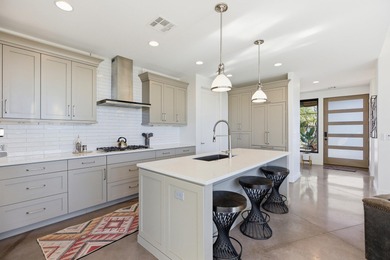 This stunning property is located in the gated Encanto community on Entrada at Snow Canyon in Utah - for sale on GolfHomes.com, golf home, golf lot