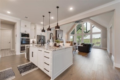 Welcome to this stunning custom-built single-story home on The Golf Club at Resort Eagle Mountain Lake in Texas - for sale on GolfHomes.com, golf home, golf lot