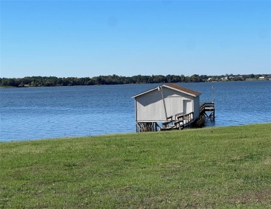 This waterfront property boasts a panoramic view of Lake Fork for sale on GolfHomes.com