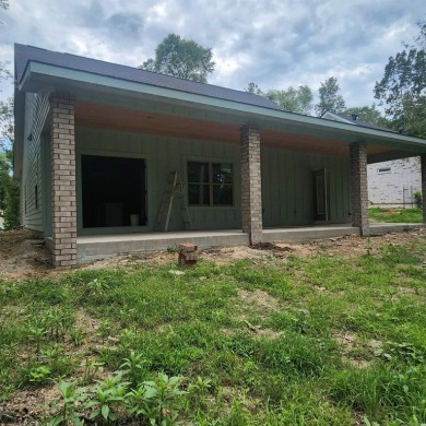 Introducing this impressive newly constructed residence on Diamondhead Golf and Country Club in Arkansas - for sale on GolfHomes.com, golf home, golf lot
