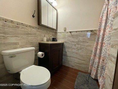 Welcome to your new mountain retreat! This beautiful 3-bedroom on Pocono Farms Country Club in Pennsylvania - for sale on GolfHomes.com, golf home, golf lot