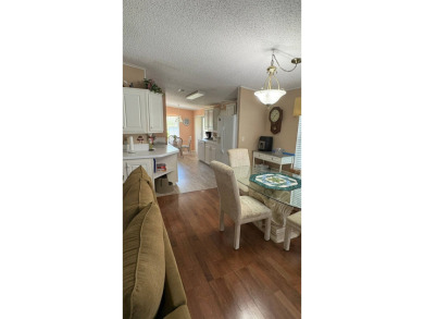 This move-in-ready gem has 2 bedrooms, 2 baths, and is located on Sabal Springs Golf and Racquet Club in Florida - for sale on GolfHomes.com, golf home, golf lot